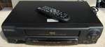 Sansui VCR4510C Video Cassette Recorder & Original Remote Head Works Great Used. Price: $49.99.