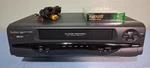 Symphonic SE226D Vhs Player/ Recorder With Av Cables And Recordable Tape Used. Price: $37.50.