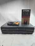 Quasar VHQ720 Vhs Vcr Player Recorder W/ Av Cables + Blank Tape Tested Black Used. Price: $48.00.