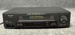 Sharp VC-A593U Vhs Vcr 4-HEAD Stereo Hq Video Cassette Recorder Black Used. Price: $85.00.