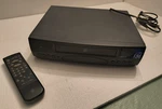 Ge-general Electric Vhs Hq -vcr Tape Player/recorder + Remote Parts & Repair! Used. Price: $25.00.